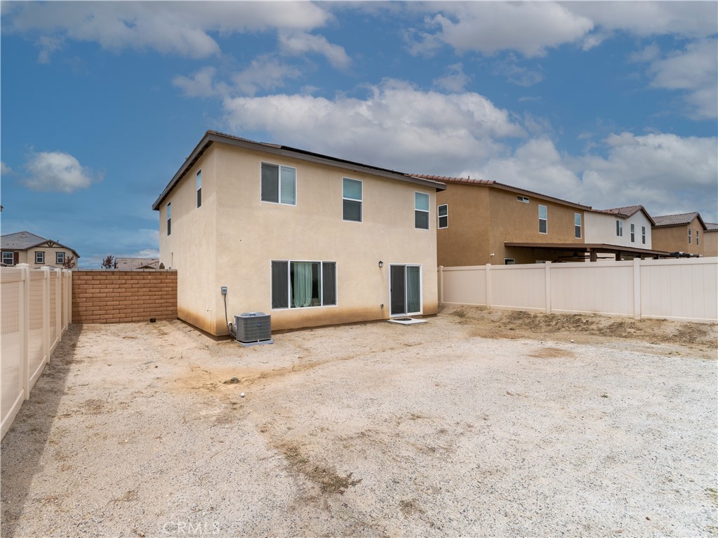 25602 Pne Rdg Road Homeland, CA 92548 - Photo 27 of 35 a view of a white house with a yard
