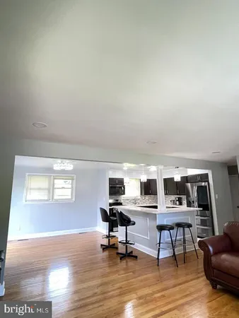 a workspace with furniture hardwood and a window