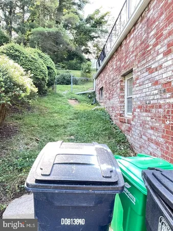 a view of a backyard with sitting area