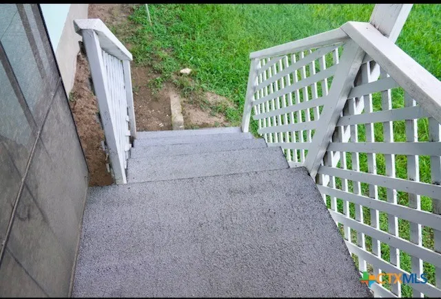 a kitchen with a white stove top oven and refrigerator