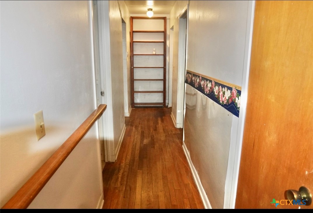 141 Jackson Street Elgin, TX 78621 - Photo 17 of 28 a view of a staircase