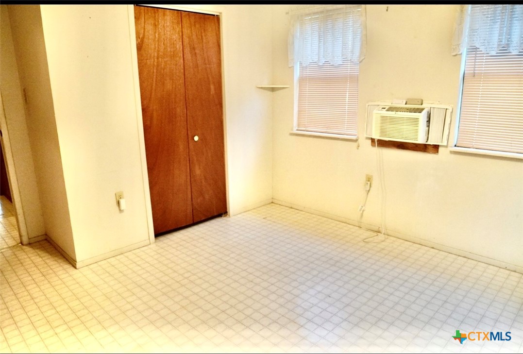 141 Jackson Street Elgin, TX 78621 - Photo 26 of 28 a view of empty room with painted walls