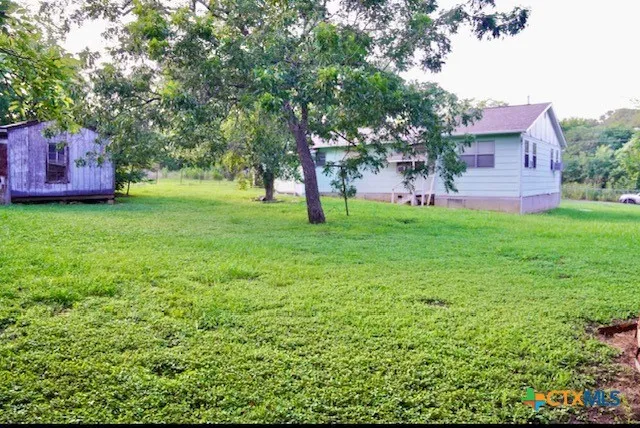 a fire hydrant in the middle of a field