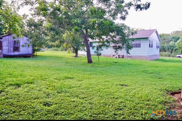 141 Jackson Street Elgin, TX 78621 - Photo 8 of 28 a fire hydrant in the middle of a field
