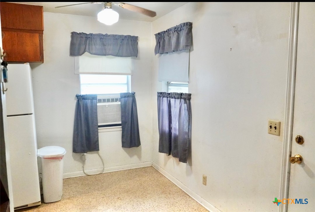 141 Jackson Street Elgin, TX 78621 - Photo 9 of 28 a bathroom with a sink and a mirror