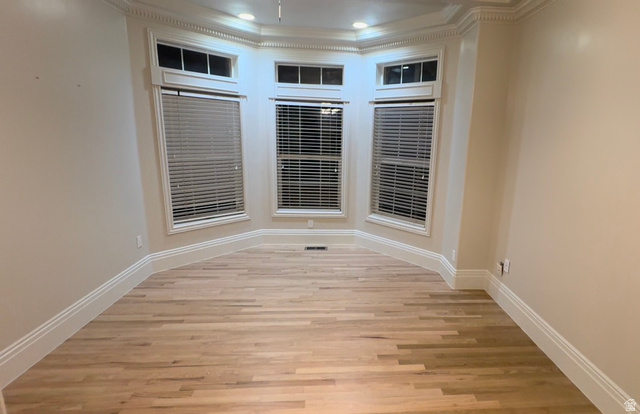 11902 Autumn Ridge Drive East Sandy, UT 84092 - Photo 2 of 5 Spare room with ornamental molding and light wood-type flooring
