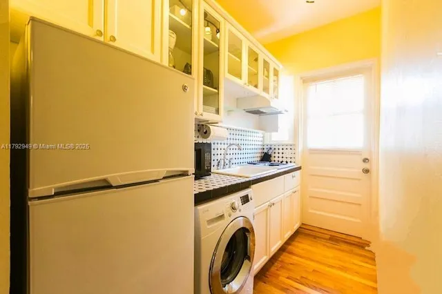 a utility room with dryer and washer