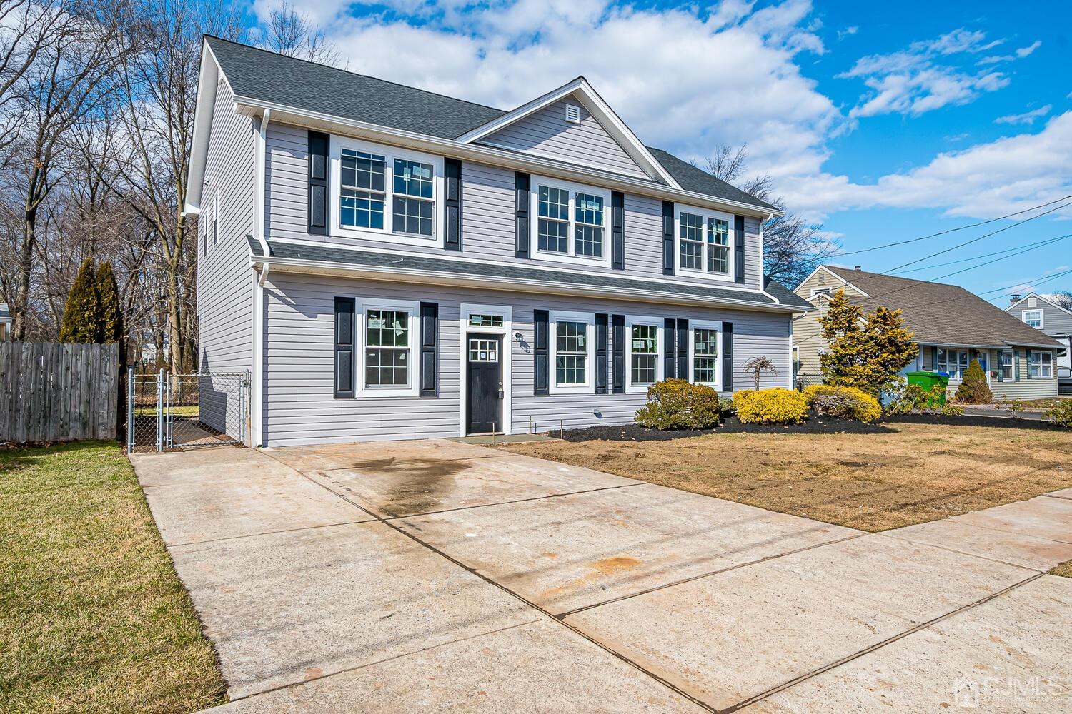 31 Sturgis Road Edison, NJ 08817 - Photo 2 of 35 front view of a brick house with a yard