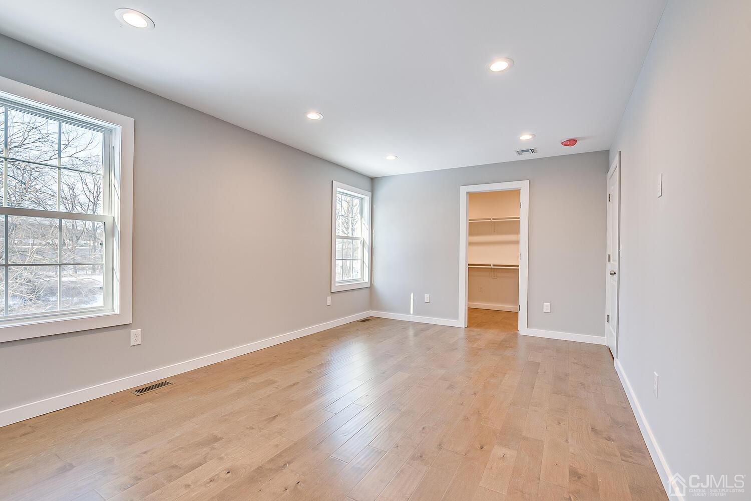 31 Sturgis Road Edison, NJ 08817 - Photo 25 of 35 an empty room with wooden floor and windows