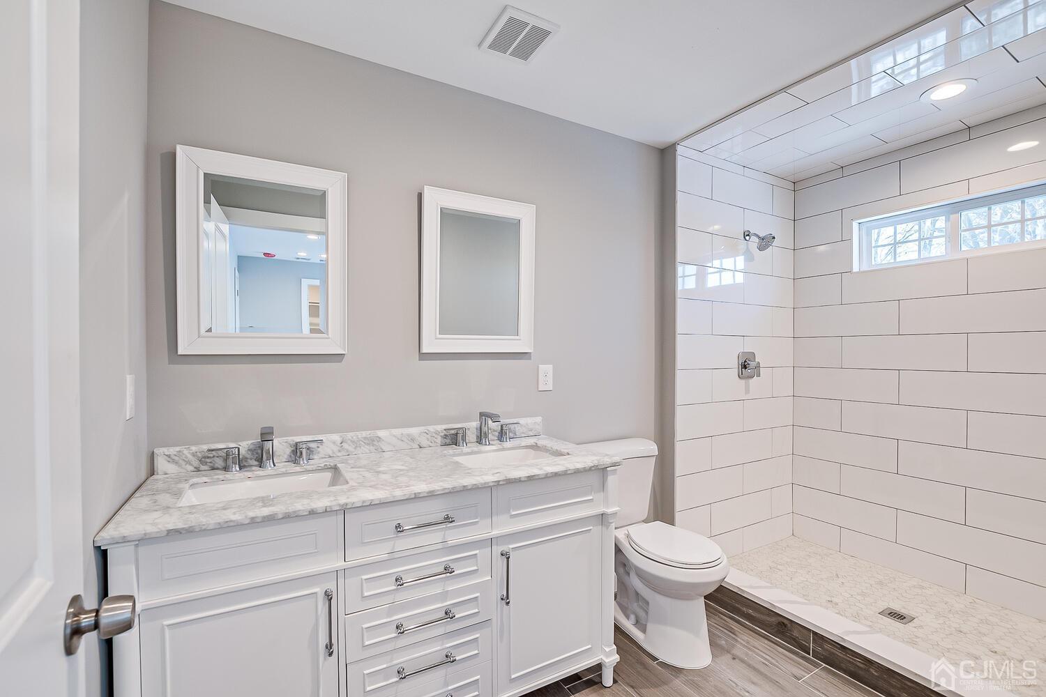 31 Sturgis Road Edison, NJ 08817 - Photo 27 of 35 a bathroom with a sink a toilet and shower