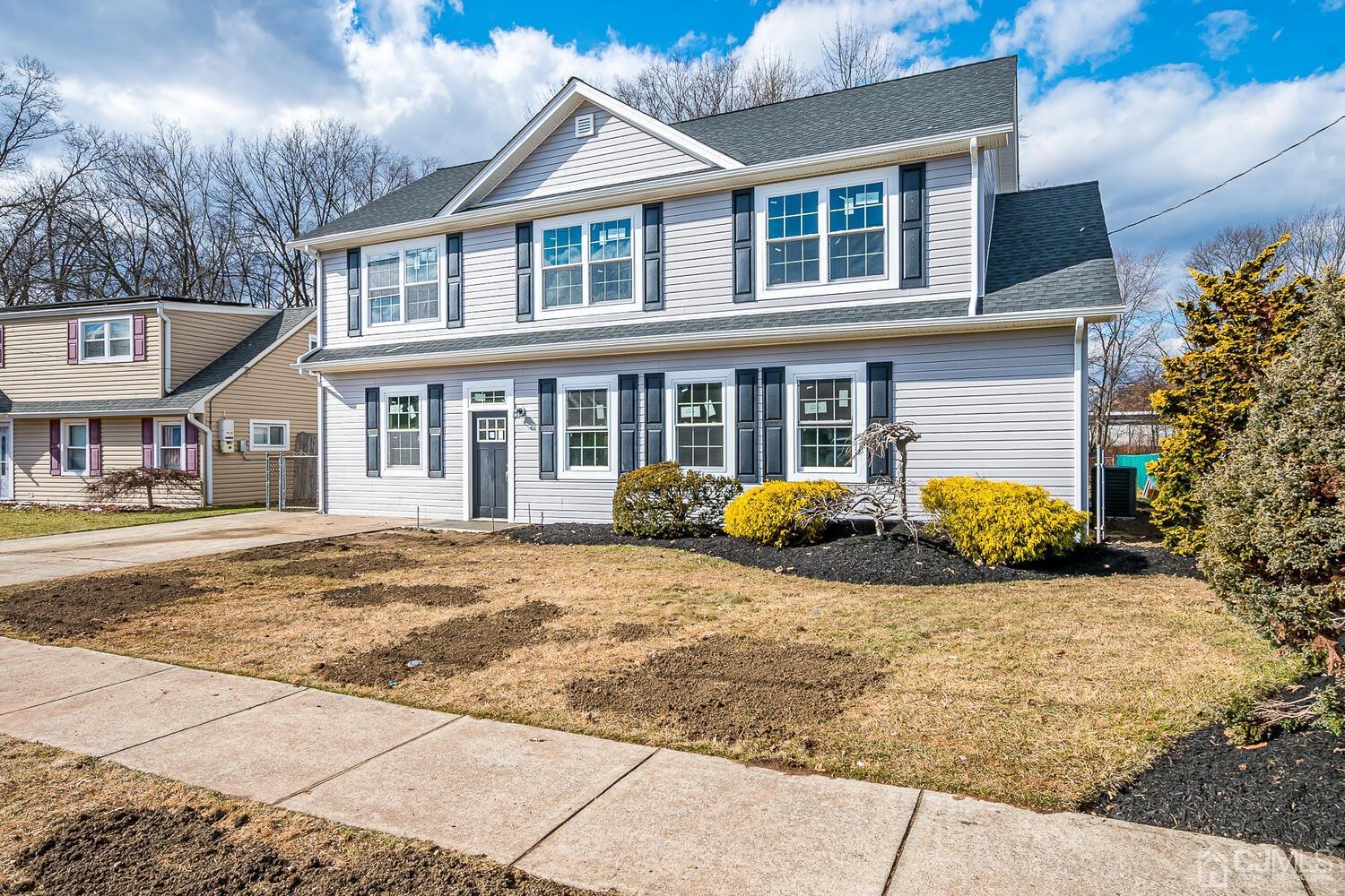 31 Sturgis Road Edison, NJ 08817 - Photo 3 of 35 a front view of a house with a yard
