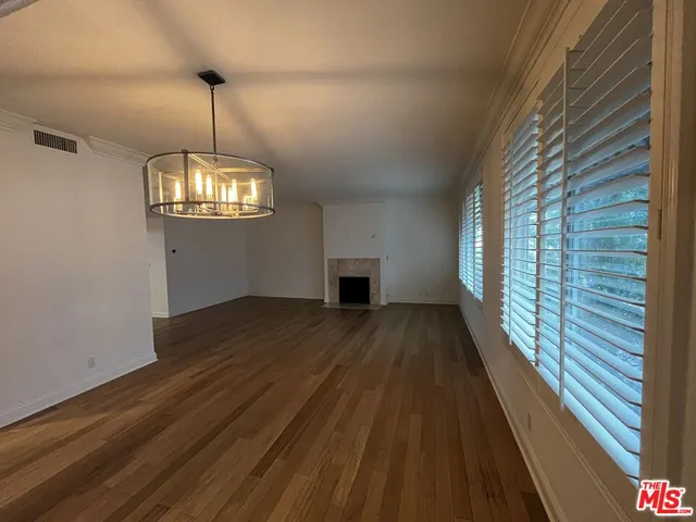 wooden floor in an empty room with a gallery