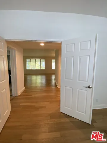 a view of a street with a building in the background