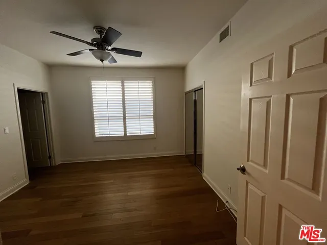 a bathroom with a sink vanity and a mirror