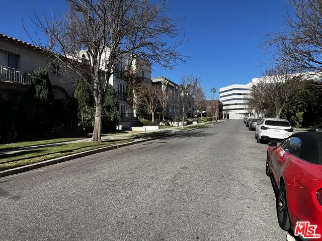 a view of hallway with wooden floor