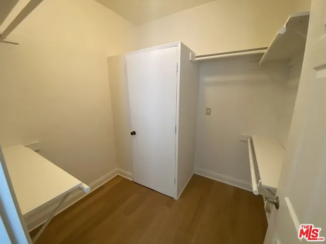 a view of hallway with window and stairs