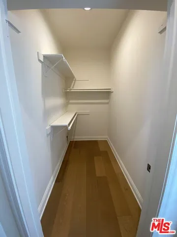 a bathroom with a granite countertop sink toilet a mirror and bathtub