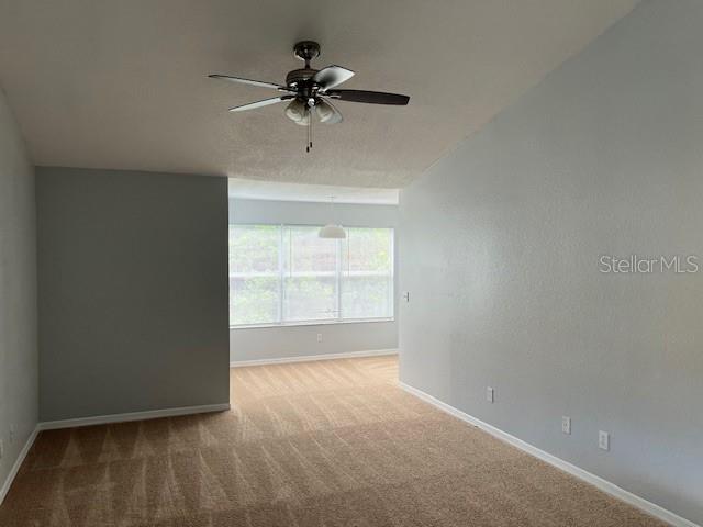 5128 Conroy Road, Unit 22 Orlando, FL 32811 - Photo 4 of 9 a view of an empty room with a window