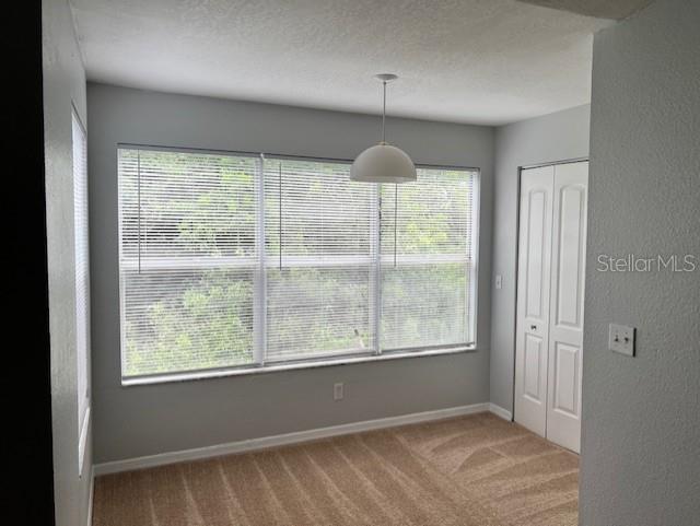 5128 Conroy Road, Unit 22 Orlando, FL 32811 - Photo 7 of 9 a view of an empty room with a window