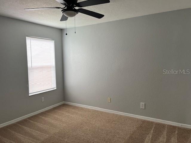 5128 Conroy Road, Unit 22 Orlando, FL 32811 - Photo 9 of 9 an empty room with a window and a fan