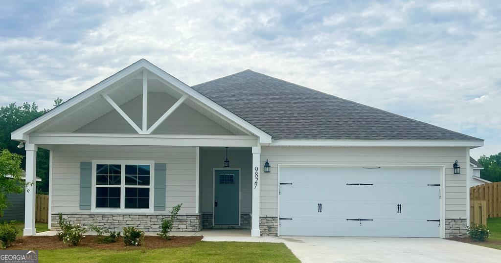9827 Yellow Pine Road Midland, GA 31820 - Photo 1 of 1 a front view of a house with garage