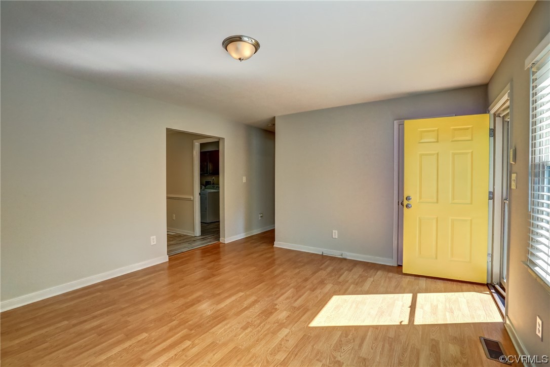 1522 Rayburn Road Richmond, VA 23235 - Photo 13 of 38 an empty room with wooden floor and windows