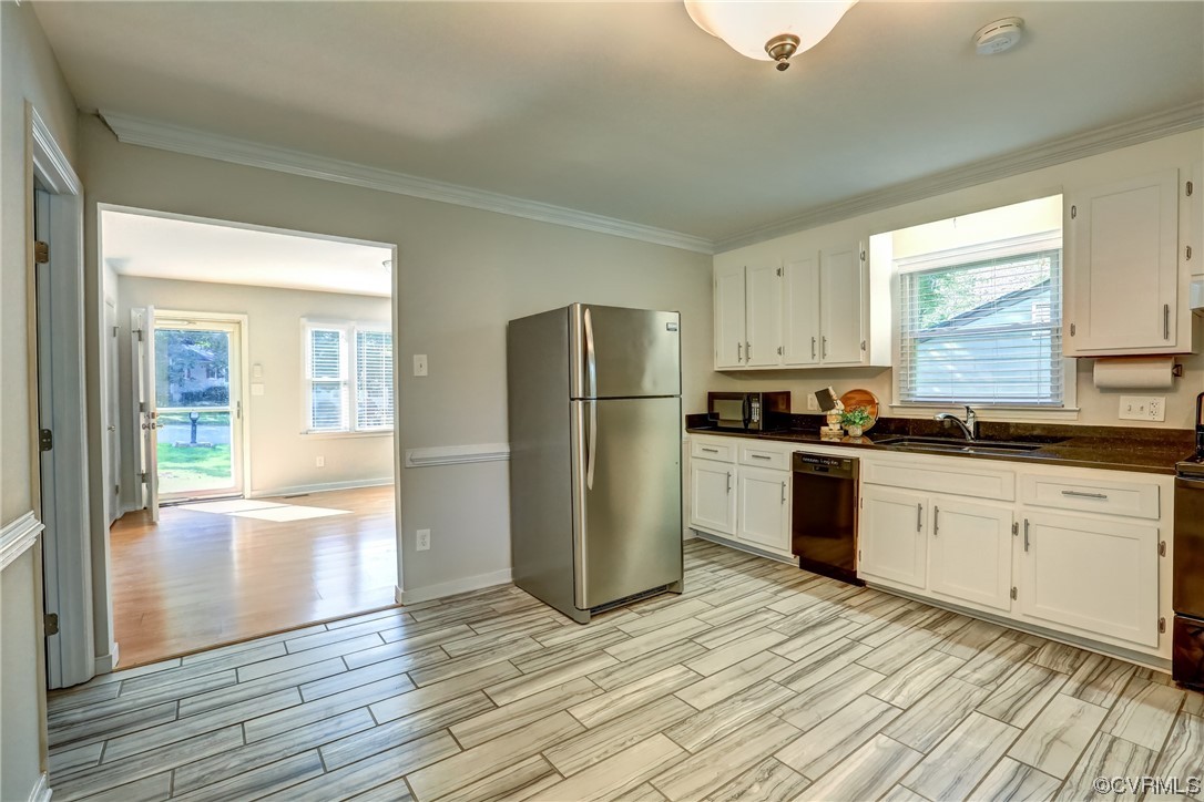 1522 Rayburn Road Richmond, VA 23235 - Photo 16 of 38 a kitchen with a refrigerator a stove and cabinets