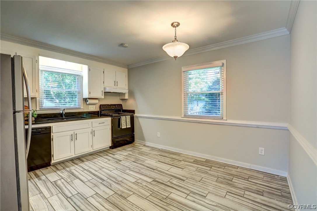 1522 Rayburn Road Richmond, VA 23235 - Photo 19 of 38 a kitchen with granite countertop a stove a sink and a refrigerator