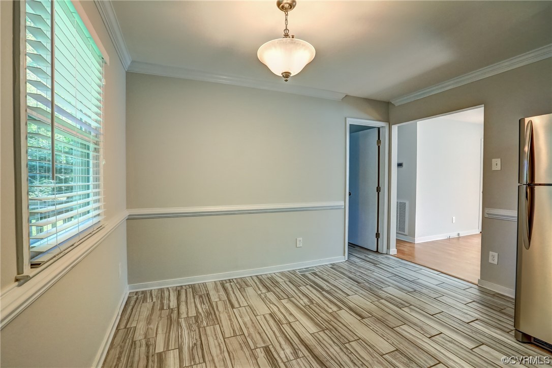 1522 Rayburn Road Richmond, VA 23235 - Photo 20 of 38 a view of empty room with wooden floor and fan