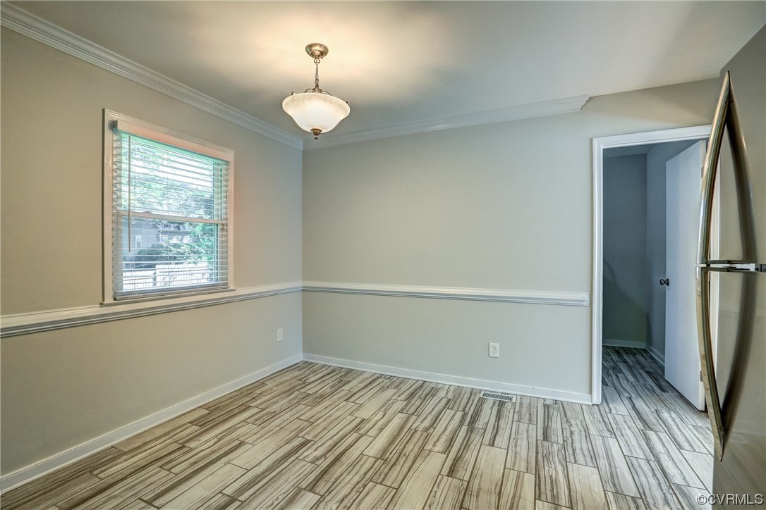 1522 Rayburn Road Richmond, VA 23235 - Photo 21 of 38 wooden floor in an empty room with a window