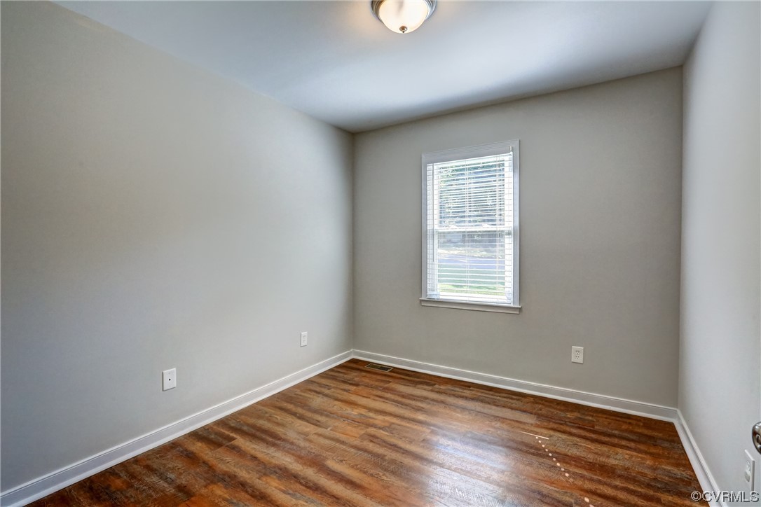 1522 Rayburn Road Richmond, VA 23235 - Photo 24 of 38 an empty room with wooden floor and windows
