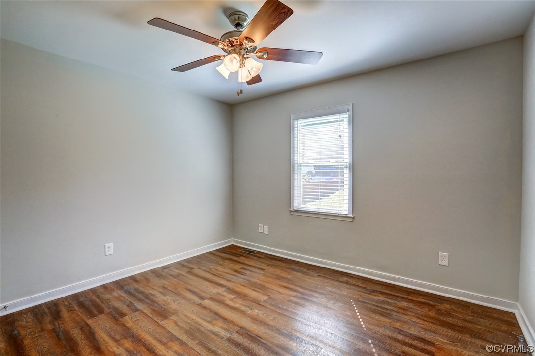 1522 Rayburn Road Richmond, VA 23235 - Photo 26 of 38 an empty room with wooden floor and windows