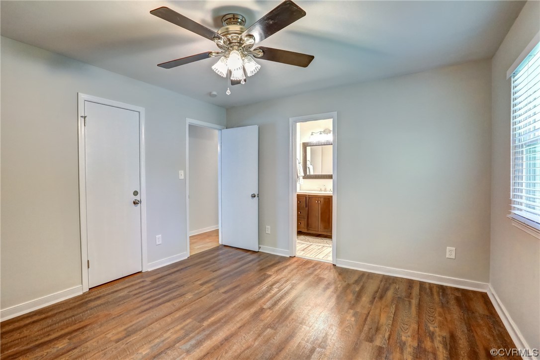 1522 Rayburn Road Richmond, VA 23235 - Photo 29 of 38 an empty room with wooden floor and windows