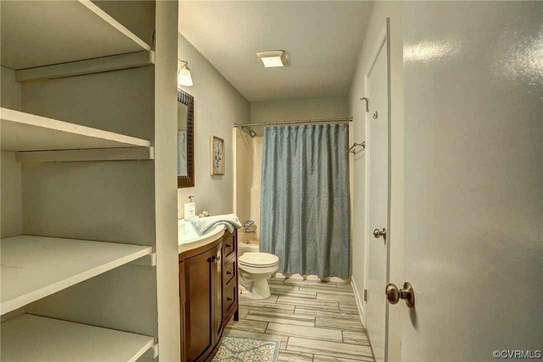 1522 Rayburn Road Richmond, VA 23235 - Photo 30 of 38 a bathroom with a sink and a mirror