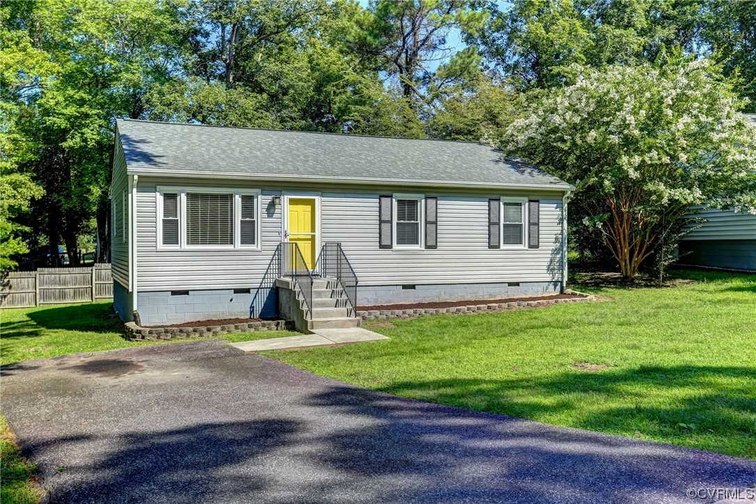 1522 Rayburn Road Richmond, VA 23235 - Photo 3 of 38 a front view of house with yard and green space