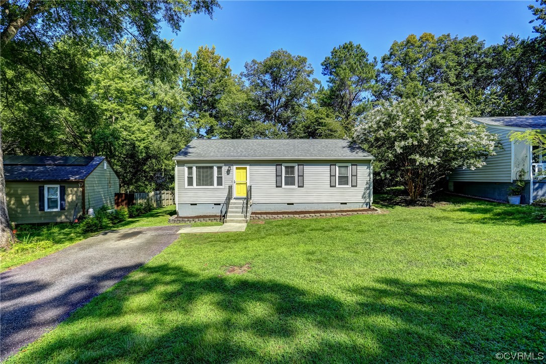 1522 Rayburn Road Richmond, VA 23235 - Photo 6 of 38 a view of a house with a yard and sitting area