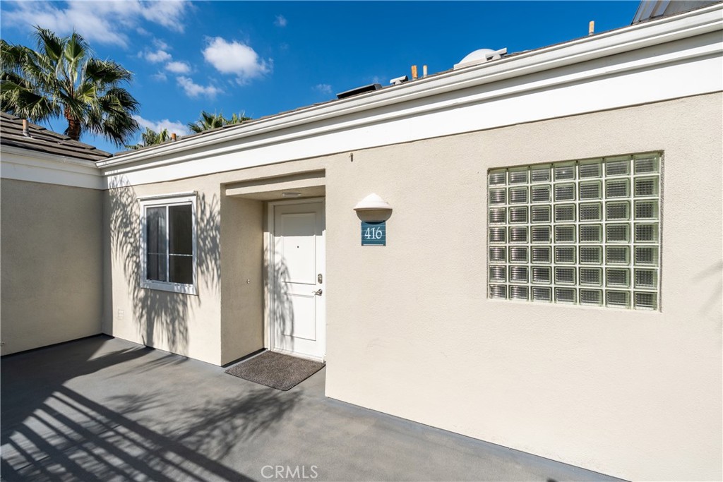 2253 Martin, Unit 416 Irvine, CA 92612 - Photo 1 of 23 a view of a porch with a potted plant