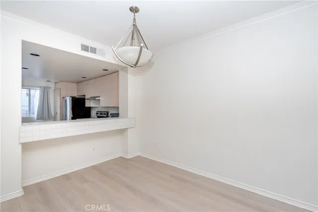 a view of a kitchen with a sink and a window