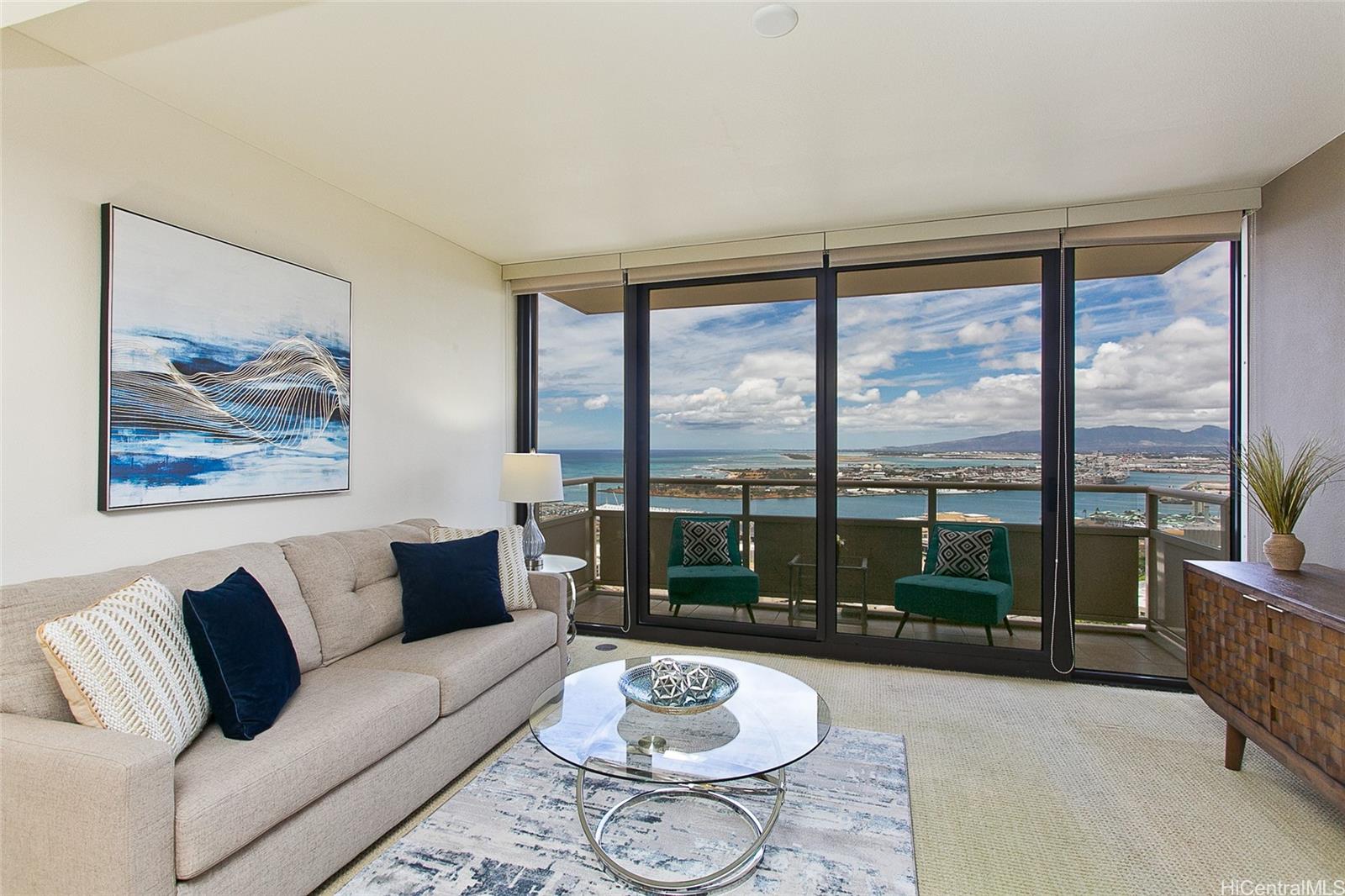 600 Queen Street, Unit 3704 Honolulu, HI 96813 - Photo 1 of 1 a living room with furniture and a large window