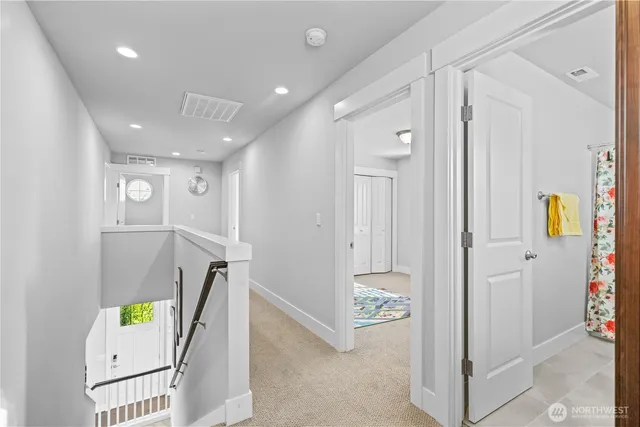 a spacious bedroom with a bed and a window