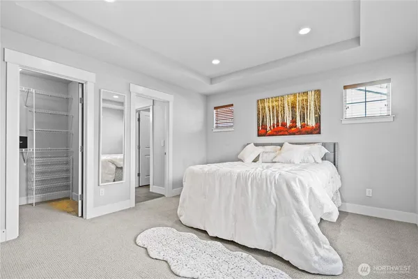 a bed room with a bed and a window