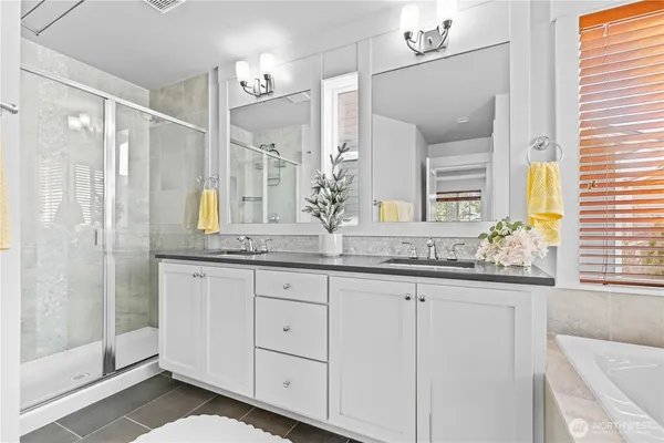a bath tub sitting in a bathroom next to a window