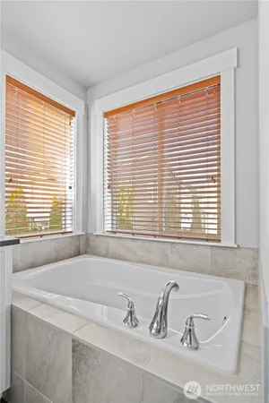 a bathroom with a shower and a sink
