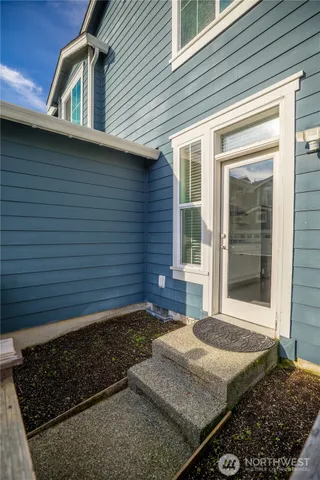 an aerial view of a house with a swimming pool