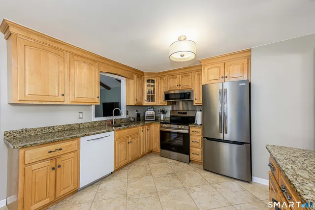 a view of walk in closet with clothes