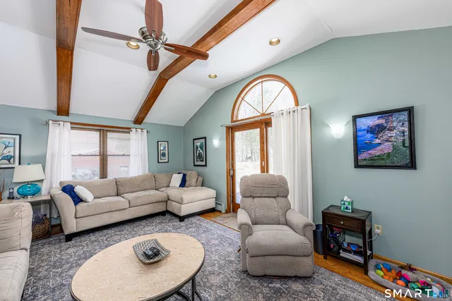 a front view of a house with a yard table and chairs