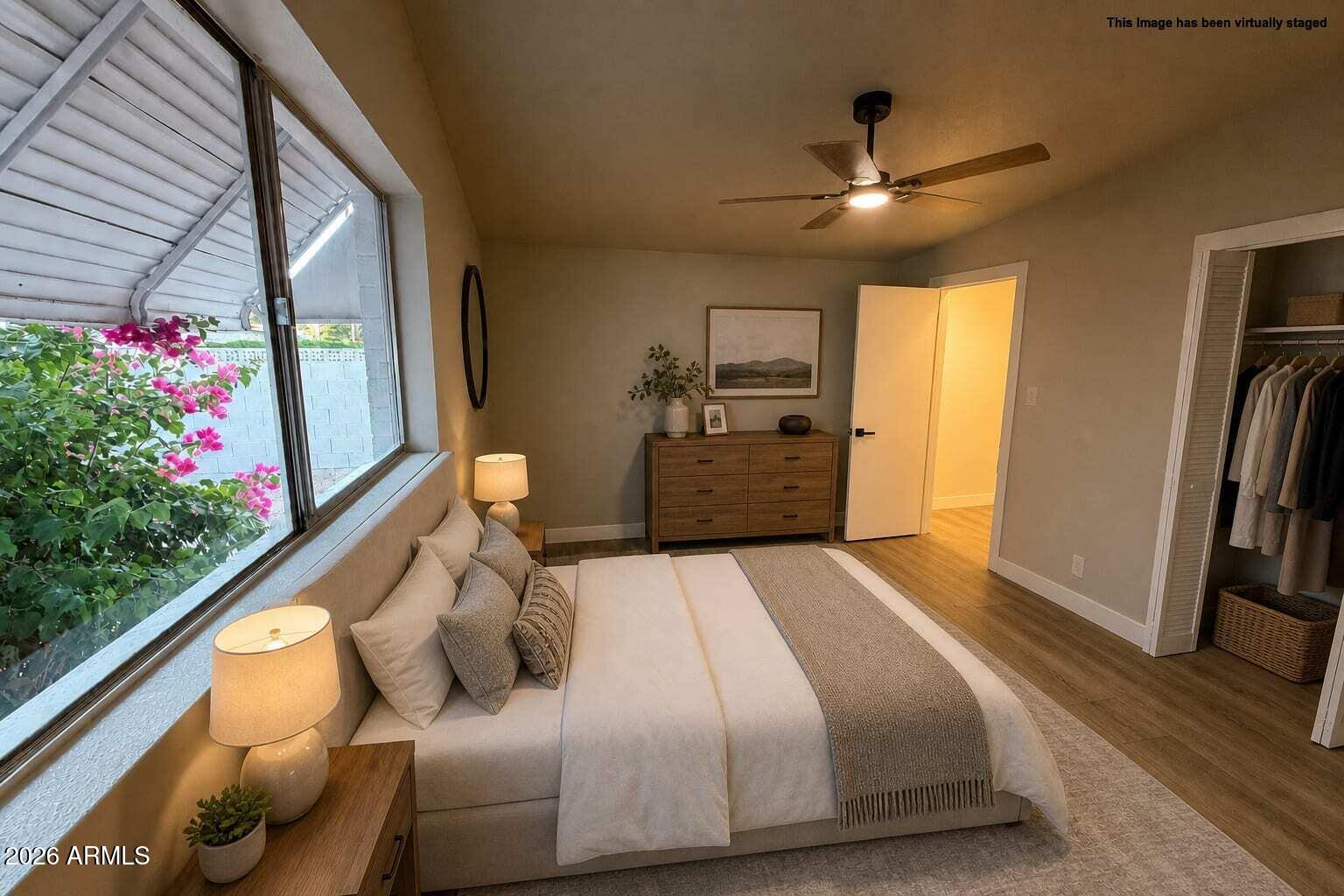 5420 North Granite Reef Road Scottsdale, AZ 85250 - Photo 12 of 30 a bedroom with a bed and a large window
