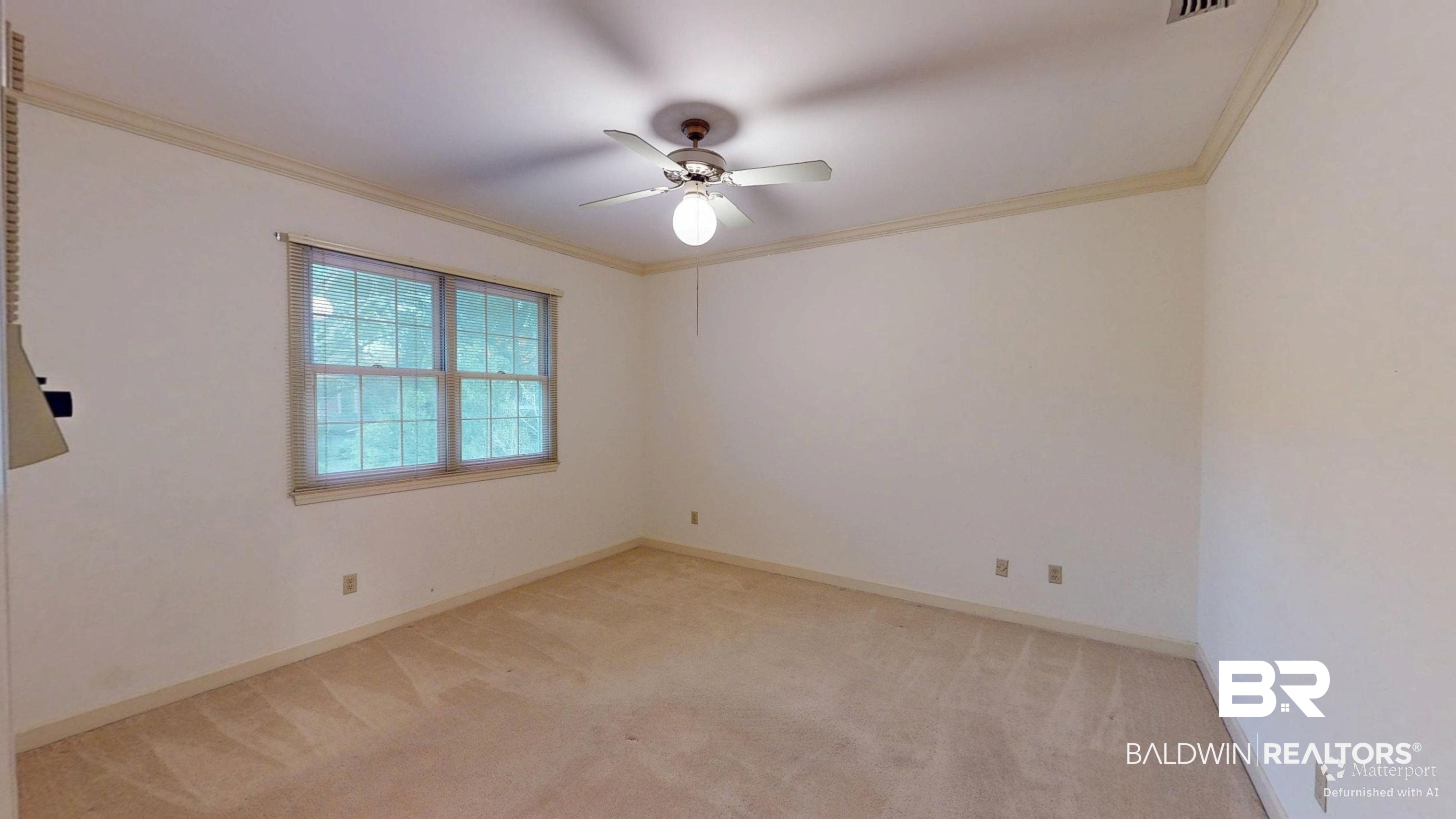 53 Warwick Road Mobile, AL 36608 - Photo 34 of 45 Spare room with ornamental molding, light carpet, and ceiling fan