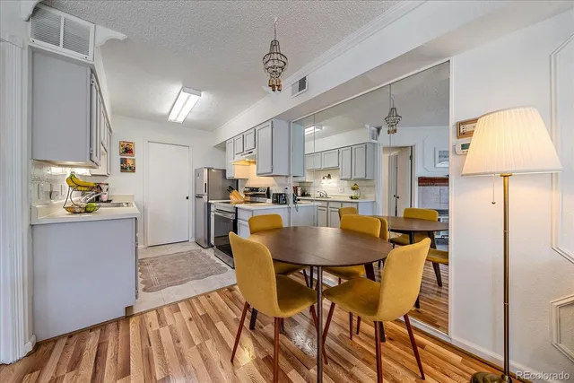 a kitchen with a sink stove and refrigerator