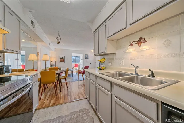 a workspace with furniture window and wooden floor